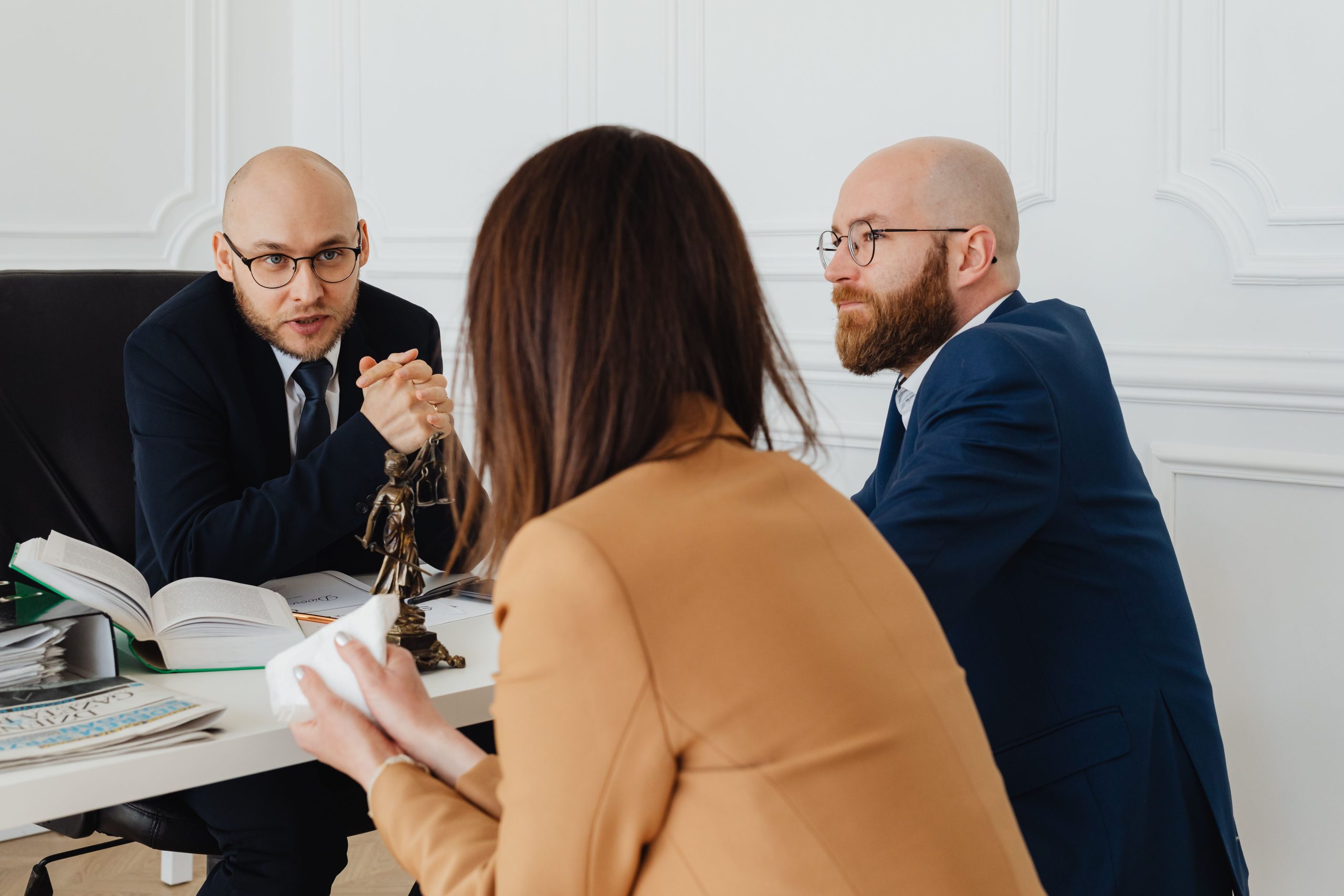 Lawyers and clients in a modern office discussing legal matters and litigation strategy